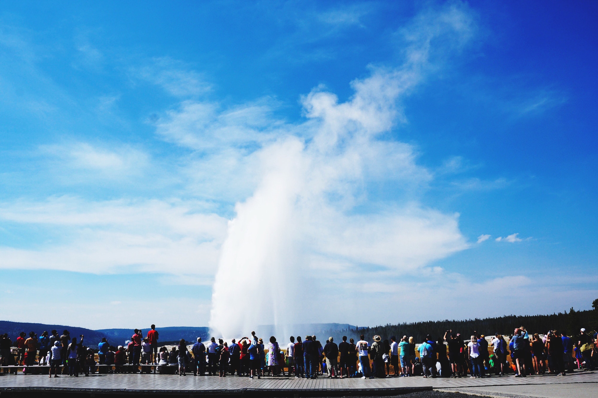 People observing Old faithful geyser